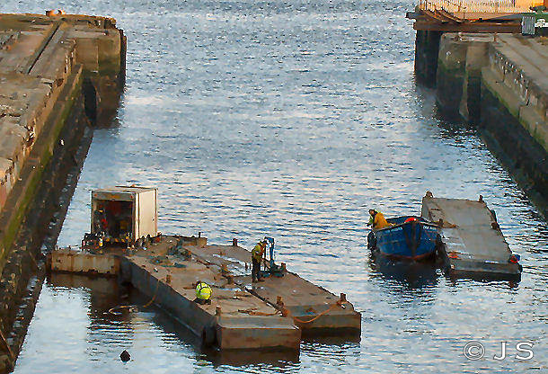 Workmen on floating gates
